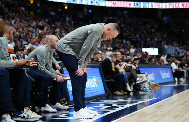 Denver Nuggets bench during tense injury moment