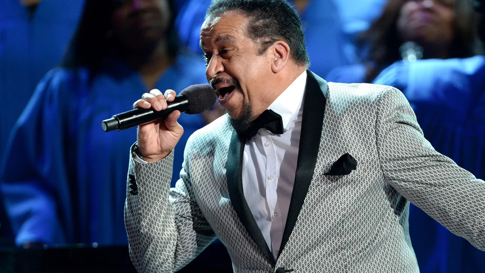 Gospel choir conductor leading singers