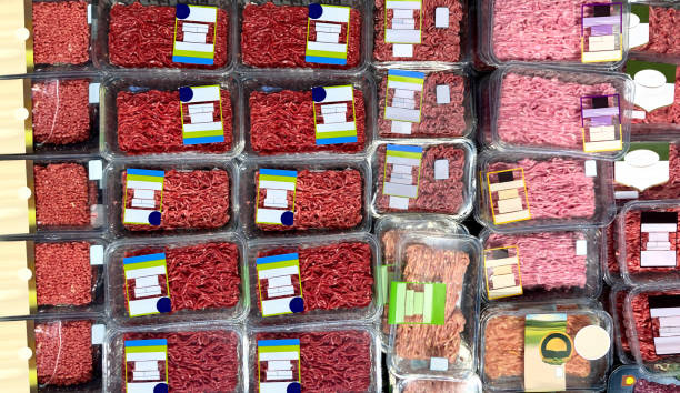 Packaged raw ground beef displayed in grocery store cooler